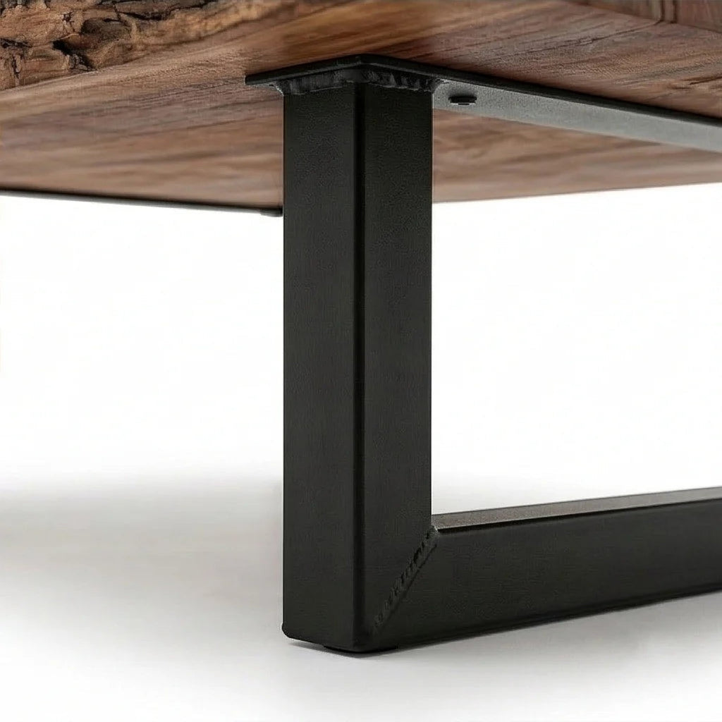 Homecrest Kestrel coffee table featuring a natural live edge solid wood slab and a black powder-coated metal base.