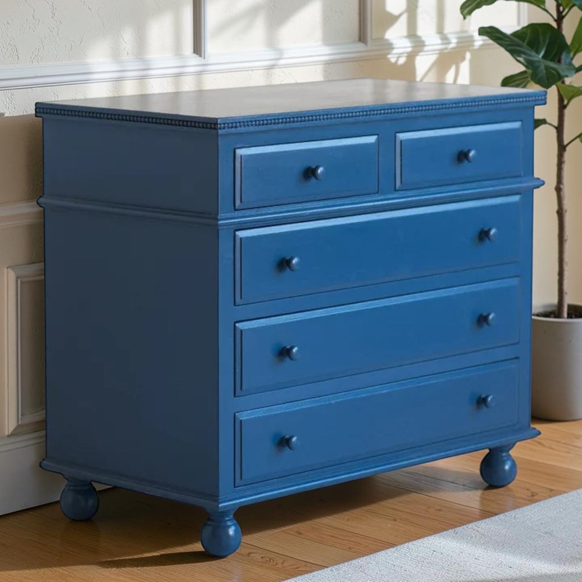 Homecrest Whitmore five-drawer chest in ultramarine blue solid mango wood with beaded moulding and bun-foot legs.
