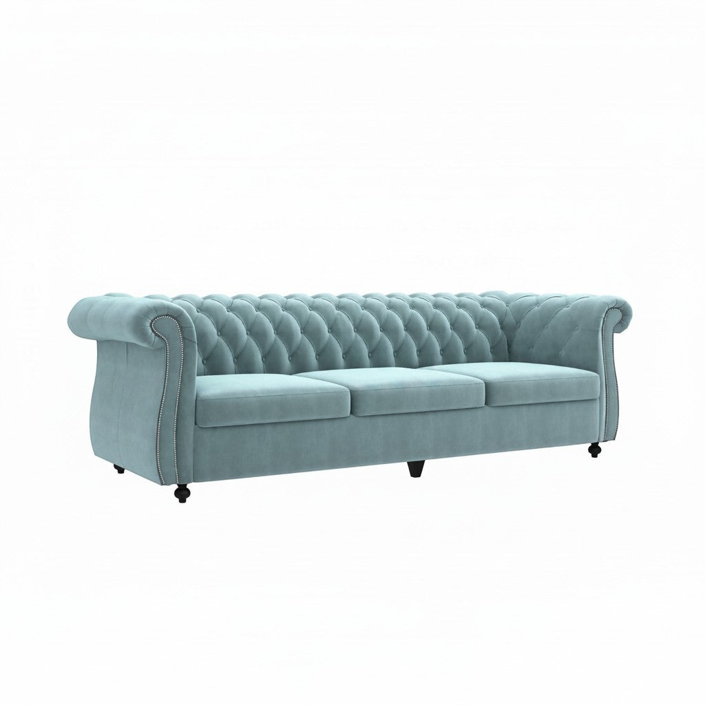 Homecrest Berkley three-seater Chesterfield sofa in dusk blue velvet with classic button tufting and nailhead trim.