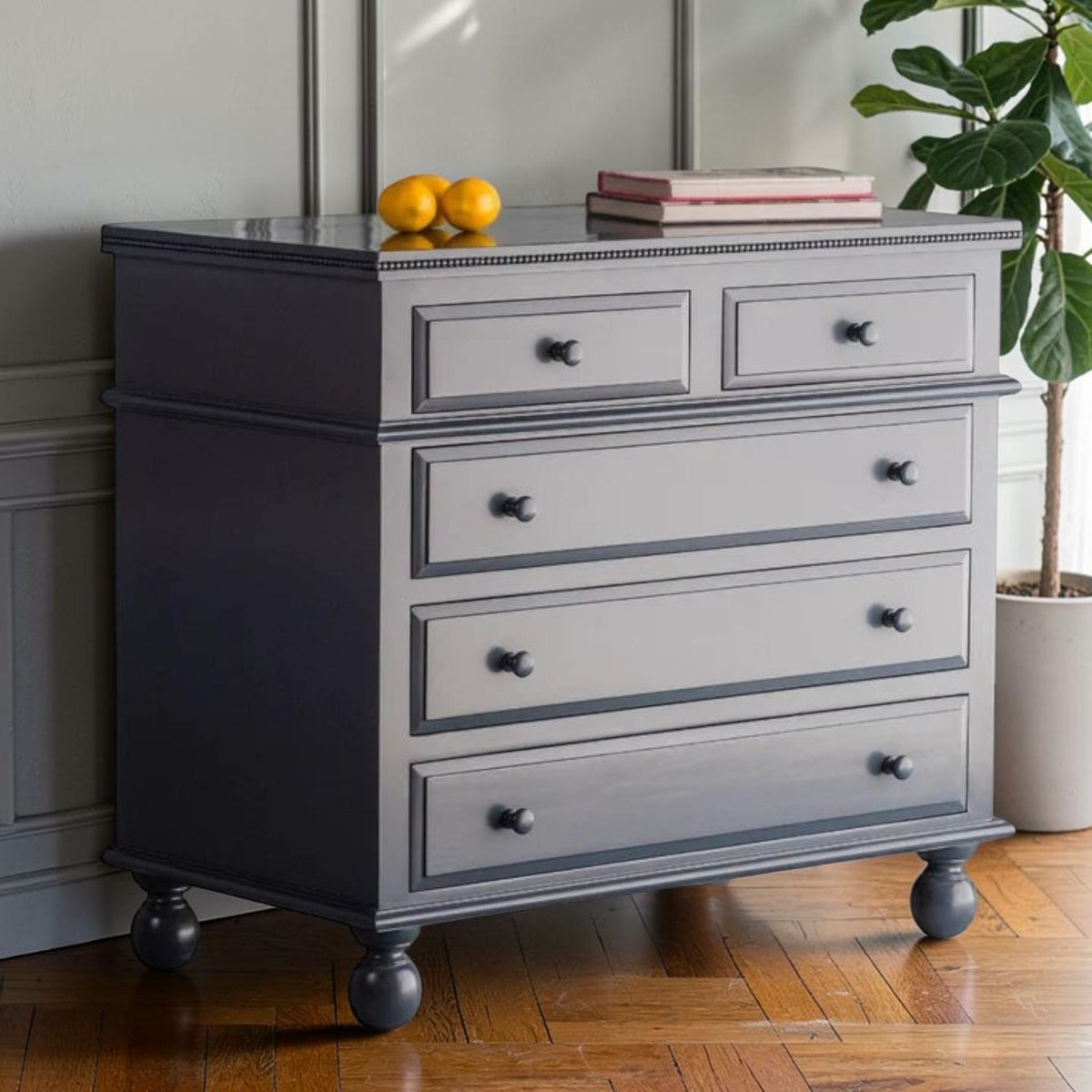 Homecrest Whitmore mango wood five-drawer chest in grey with bun-foot legs and beaded inlaid moulding detail.