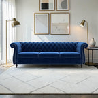 Homecrest Berkley three-seater Chesterfield sofa in indigo blue velvet with tufted back and silver nailhead trim.