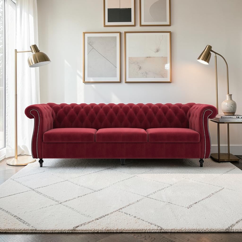 Homecrest Berkley three-seater Chesterfield sofa in pomegranate red velvet with tufted back and silver nailhead trim.