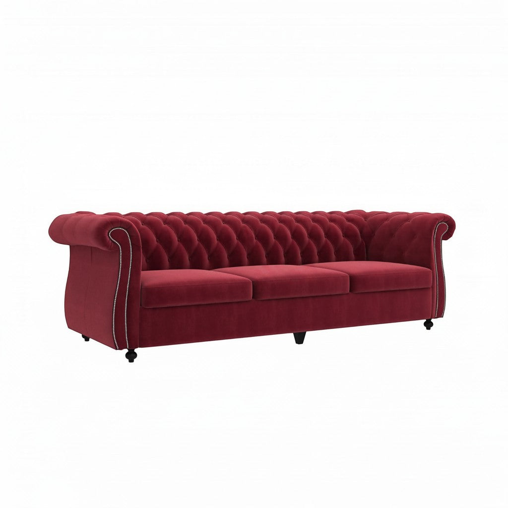 Homecrest Berkley three-seater Chesterfield sofa in pomegranate red velvet with deep button tufting and nailhead trim.
