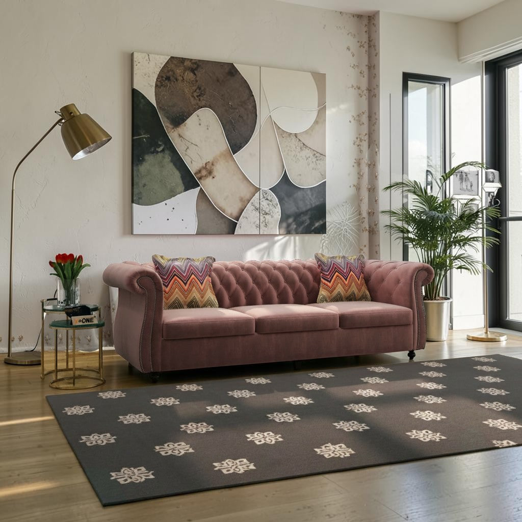 Homecrest Berkley three-seater Chesterfield sofa in rose dust velvet with button tufting and nailhead trim in a living room