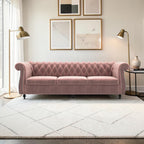 Homecrest Berkley three-seater Chesterfield sofa in rose dust velvet with tufted back and nailhead trim in a bright room