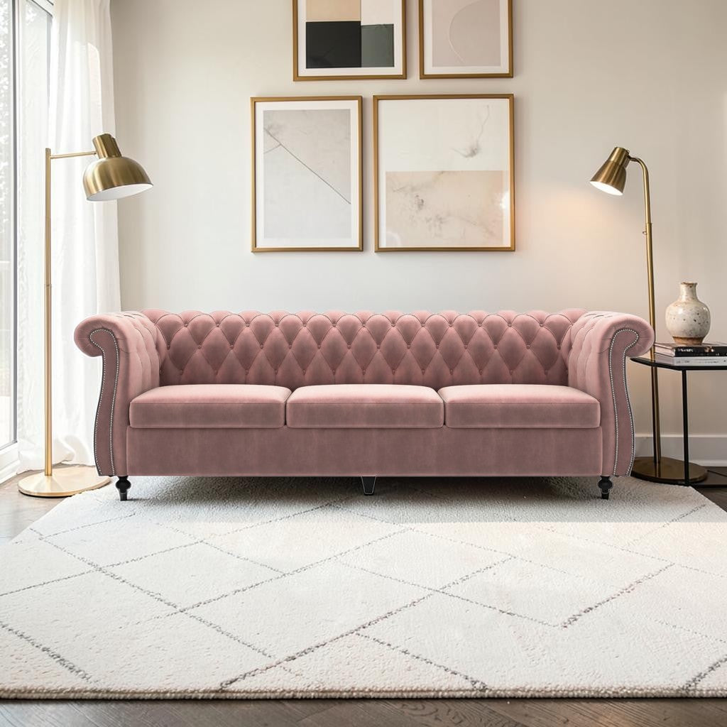 Homecrest Berkley three-seater Chesterfield sofa in rose dust velvet with tufted back and nailhead trim in a bright room