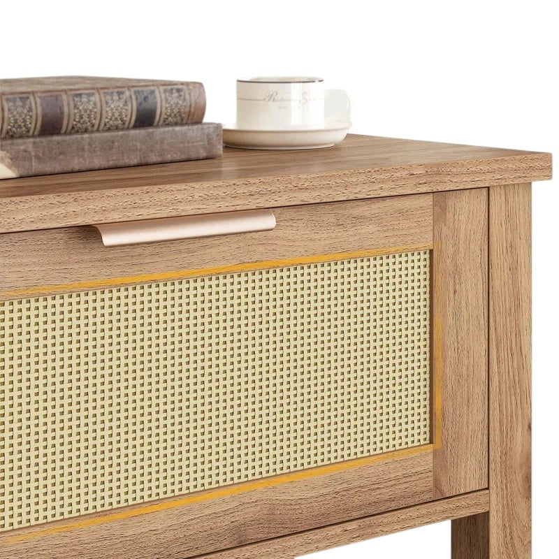Homecrest Lorne console table featuring natural acacia wood and a detailed rattan-set door panel with a metal handle.