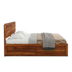 Homecrest Norbury solid wood platform bed with a horizontal slatted headboard and natural wood grain finish.