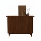 Homecrest Sennen solid Sheesham wood chest of drawers with a honey finish, viewed from the back.