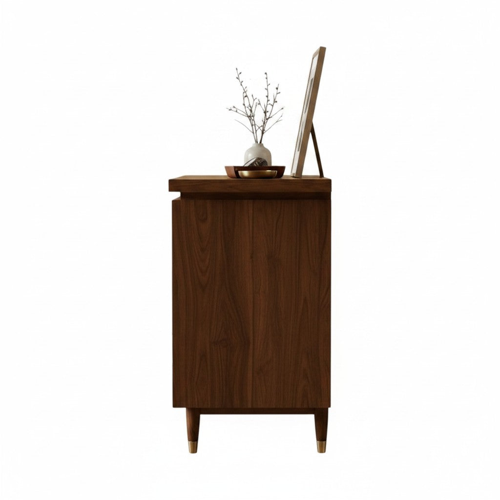 Homecrest Sennen solid Sheesham wood chest of drawers in honey finish, side view showing tapered legs with gold accents.