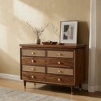 Homecrest Sennen solid Sheesham wood chest of drawers with honey finish, rattan drawer fronts, and gold hardware.