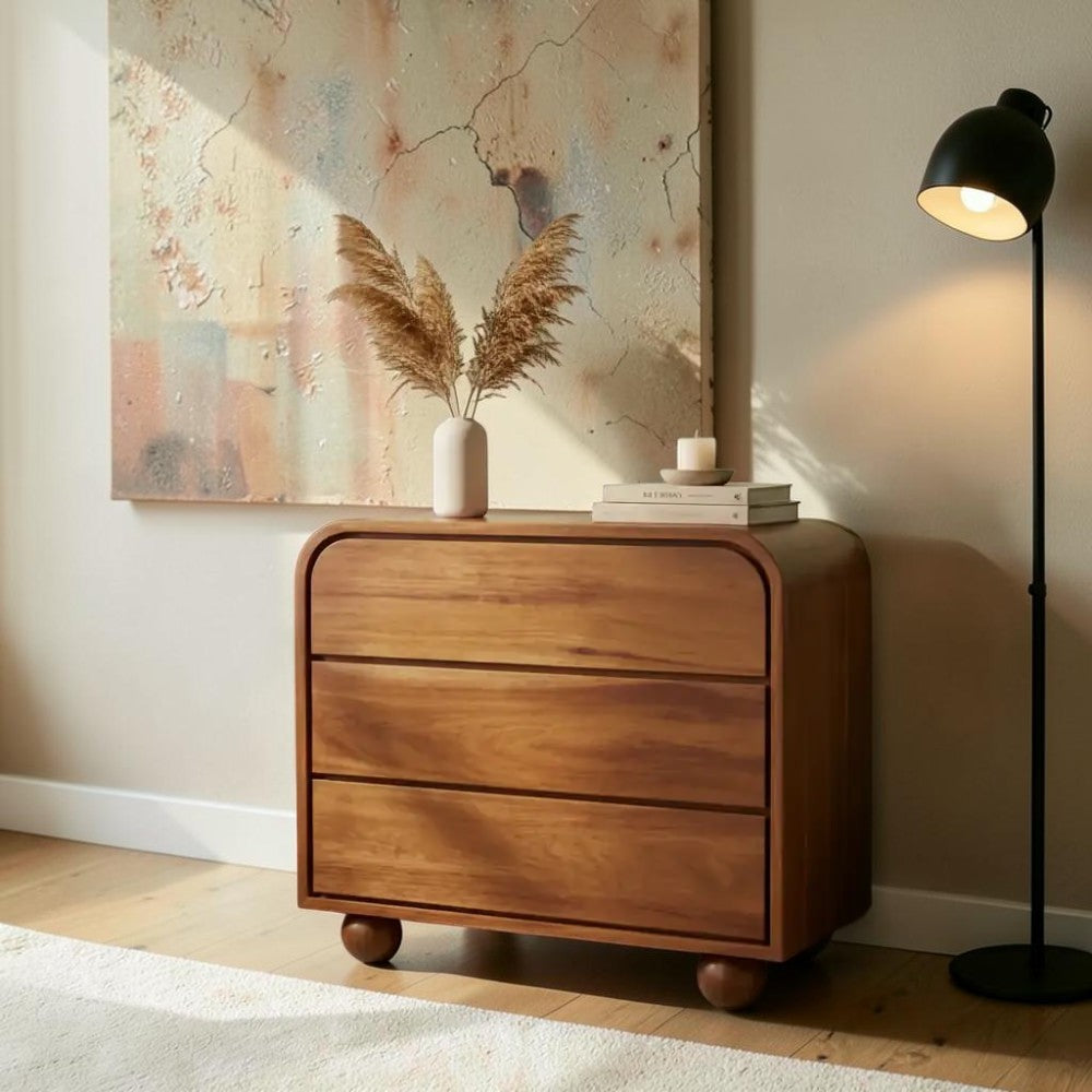 Homecrest Brisley brown acacia wood 3-drawer chest with rounded edges and spherical feet in a modern living room
