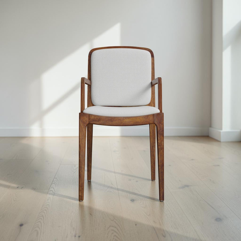 Homecrest Melbury upholstered dining chair with arms, crafted from natural teak wood with a cream cushioned seat.
