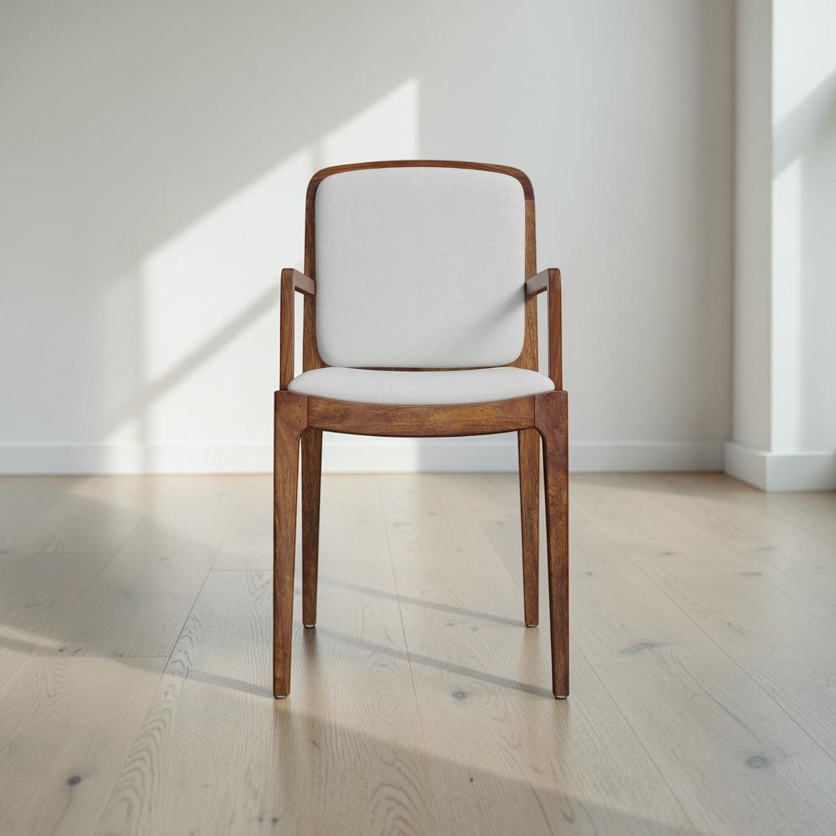 Homecrest Melbury upholstered dining chair with arms, crafted from natural teak wood with a cream cushioned seat.