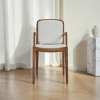 Homecrest Melbury teak wood dining chair with arms, featuring a natural wood frame and light grey upholstered seat.