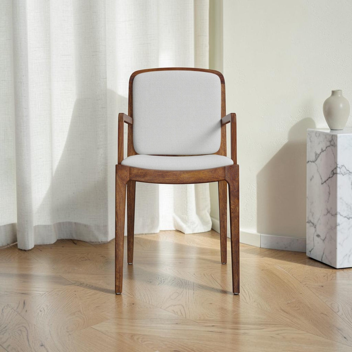 Homecrest Melbury teak wood dining chair with arms, featuring a natural wood frame and light grey upholstered seat.