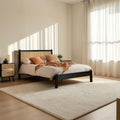 Homecrest solid mango wood bed frame with a natural woven rattan headboard in a bright, modern bedroom setting.