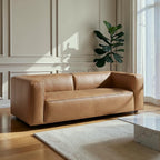Homecrest Manhattan three-seater sofa in saddle-toned upholstery with a sleek, modern low-profile design.
