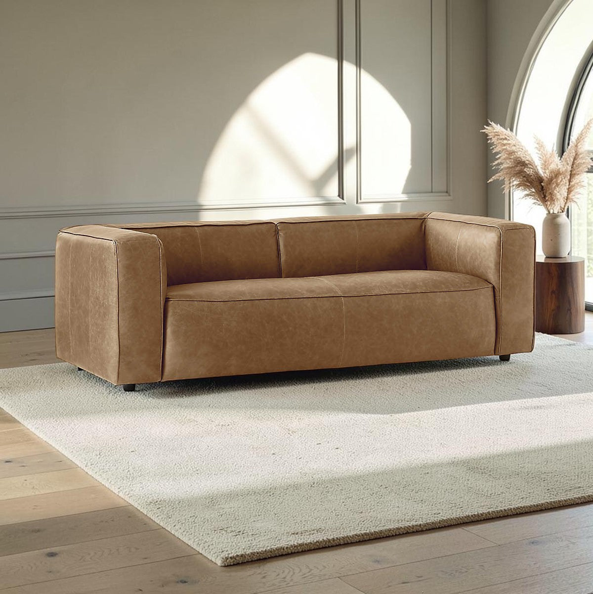 Homecrest Manhattan three-seater sofa in saddle-toned upholstery with a modern low-profile design on a light rug
