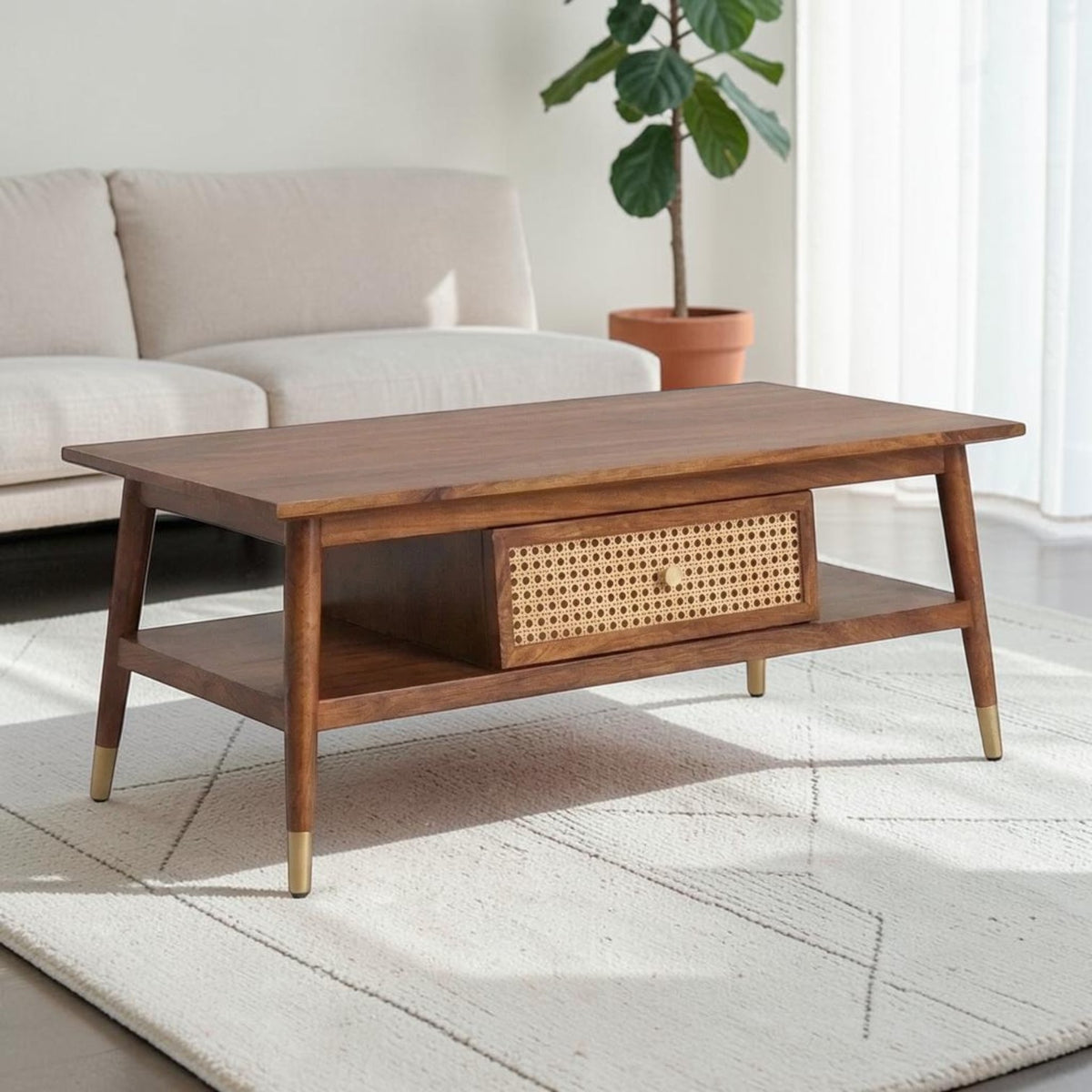 Homecrest Marlowe rectangular coffee table in natural wood with a woven cane drawer and brass-capped tapered legs.