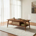 Homecrest Marlowe rectangular coffee table in natural wood with a woven cane drawer, lower shelf, and brass-capped legs