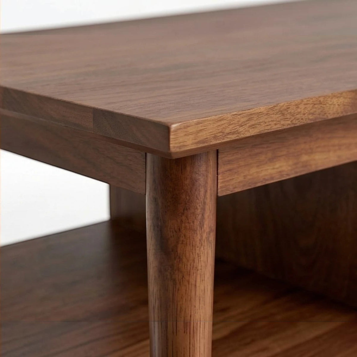 Homecrest Marlowe coffee table featuring a natural solid wood surface with tapered legs and a lower shelf detail
