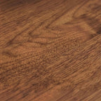 Close-up of the natural wood grain texture on the Homecrest Marlowe coffee table surface.