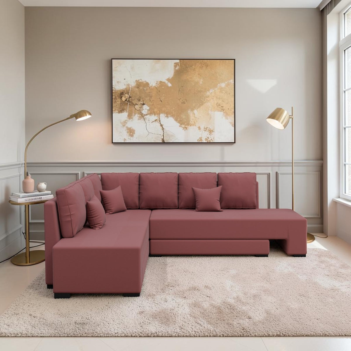 Homecrest Merrow L-shape sofa bed in pink velvet with solid wood frame, set in a modern living room with gold lamps.
