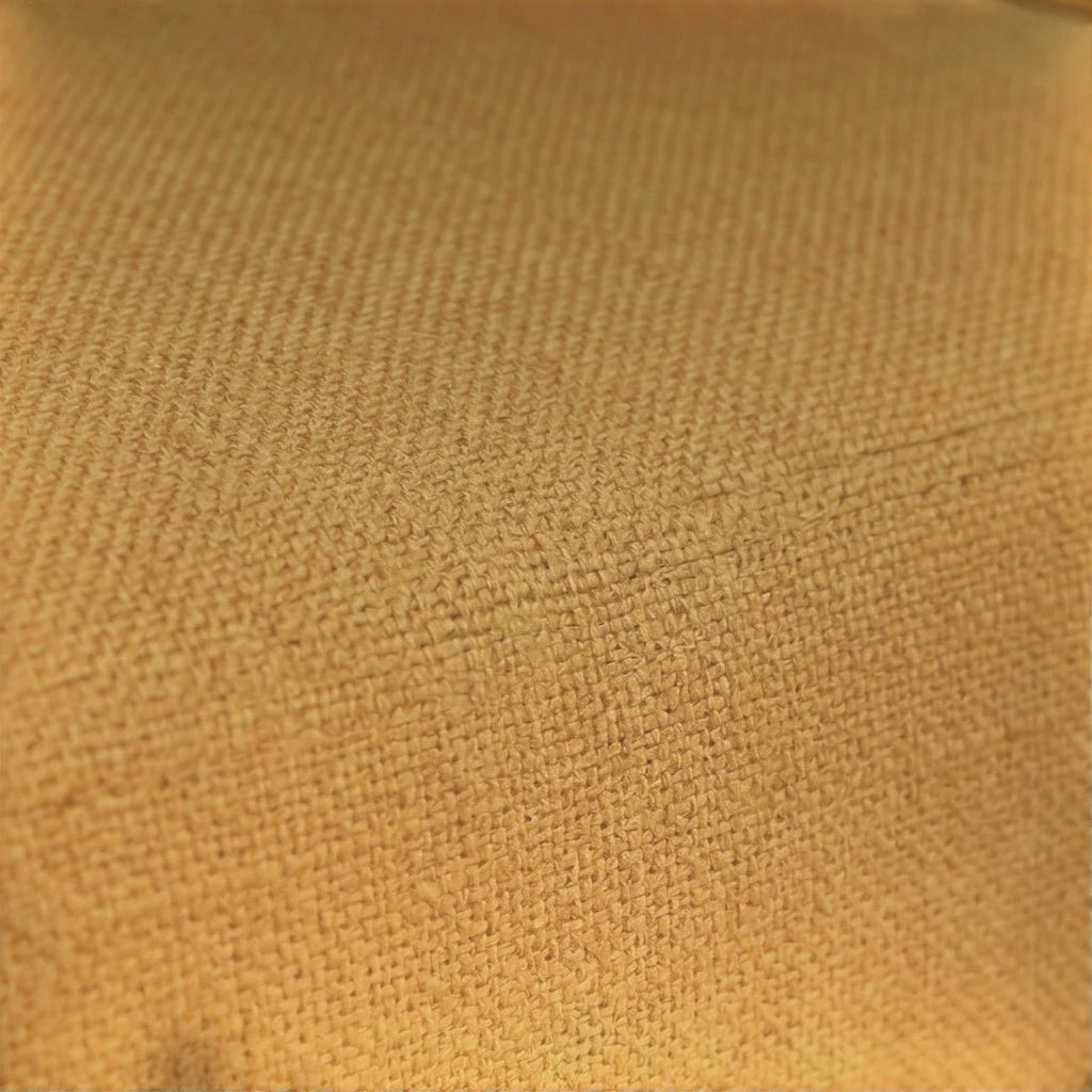 Close-up of the textured mustard yellow fabric upholstery on a Homecrest 2-seater sofa