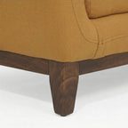 Homecrest 2-seater sofa featuring mustard fabric upholstery and a solid wood base with tapered legs