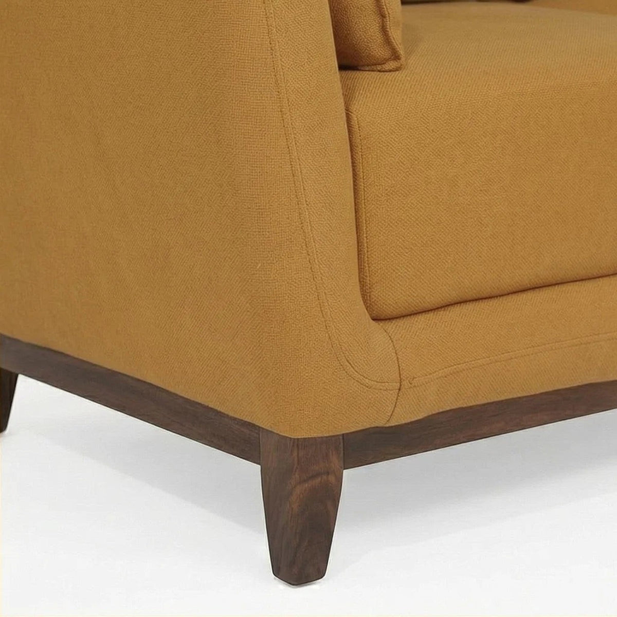Homecrest 2-seater sofa in mustard fabric with a solid wood base and curved armrest detail