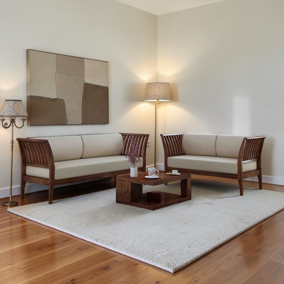 Homecrest Naunton sheesham wood sofa set with teak finish and beige upholstered cushions in a living room setting.