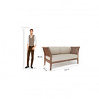 Homecrest Naunton sheesham wood sofa with teak finish, beige upholstered cushions, and slatted armrests.