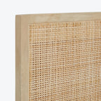 Homecrest natural mango wood bed frame with a detailed woven rattan headboard panel