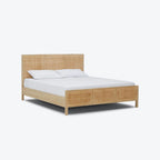 Homecrest natural mango wood bed frame featuring a woven rattan headboard and footboard with white bedding