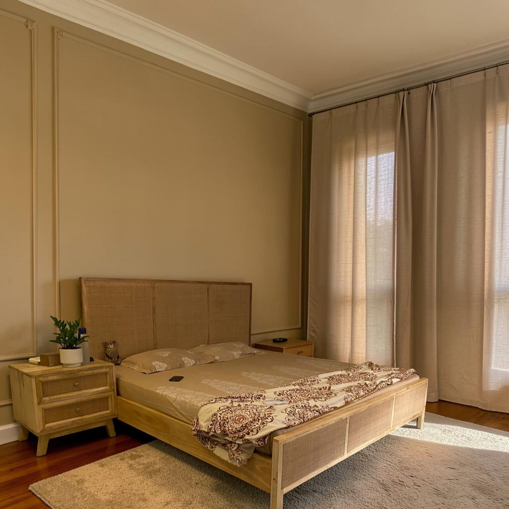 Homecrest natural mango wood bed with a woven rattan headboard and footboard in a sunlit bedroom setting