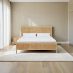 Homecrest natural mango wood bed featuring a woven rattan headboard and footboard in a bright bedroom setting