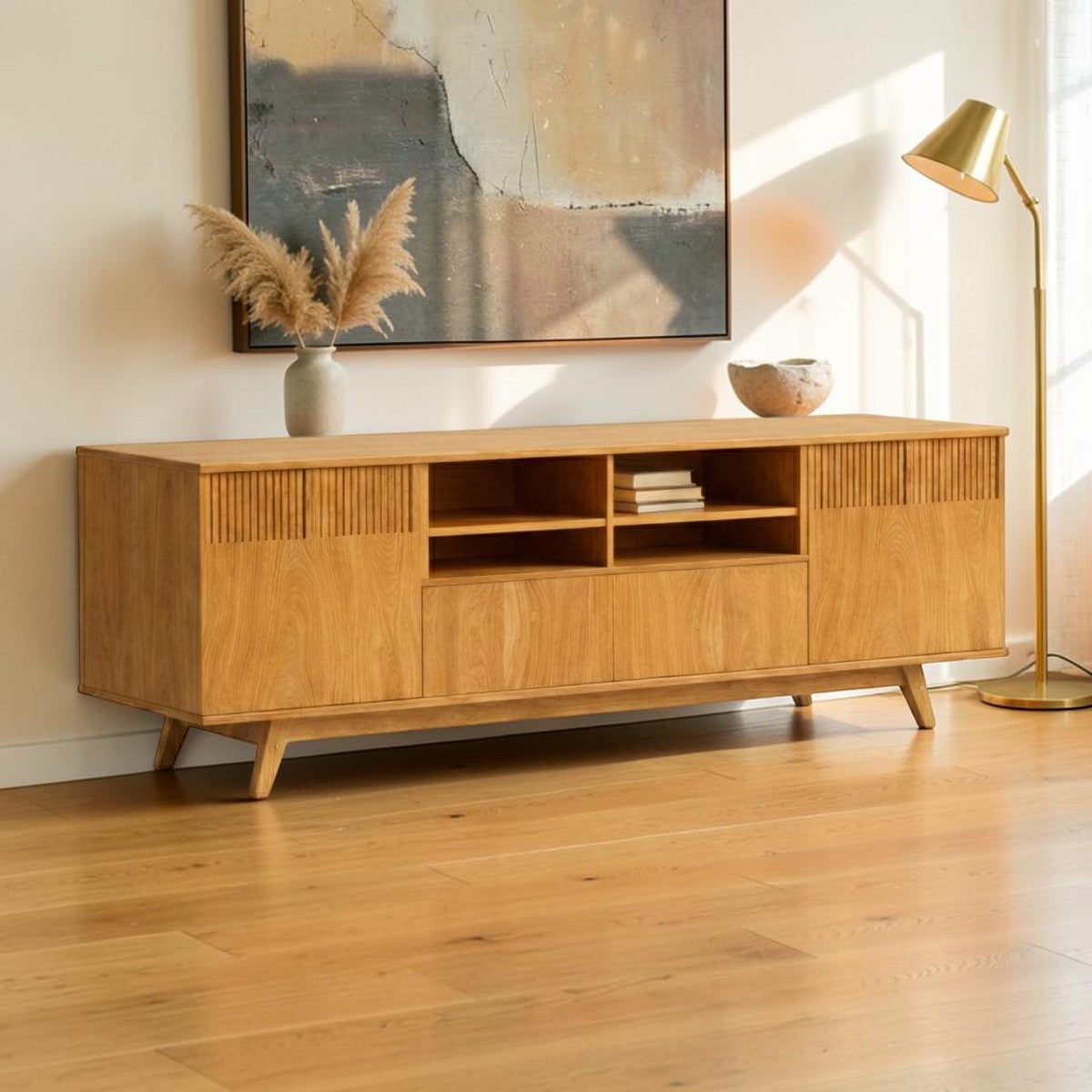 Homecrest Novar media cabinet in warm golden oak wood with signature slatted door panels and open center shelving.