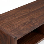 Homecrest Nyle mid-century modern coffee table in dark solid wood with rounded edges and an open shelf design