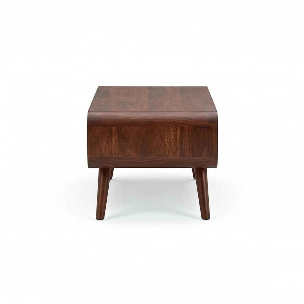 Homecrest Nyle mid-century coffee table in solid wood with rounded edges and angled legs, front view.