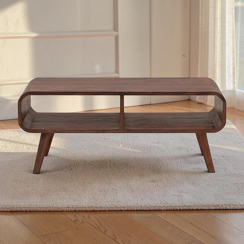 Homecrest Nyle mid-century modern solid wood coffee table with rounded edges, open shelving, and angled legs.