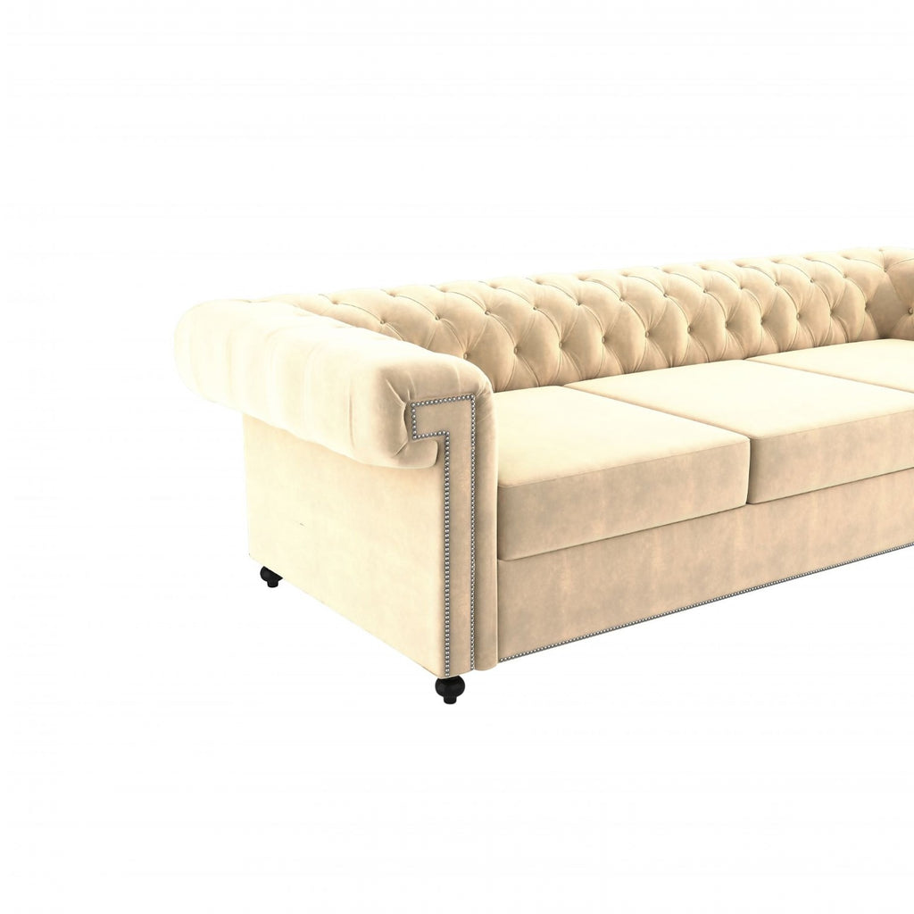 Homecrest Oakley three-seater Chesterfield sofa in beige velvet with tufted backrest and silver nailhead trim.