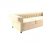 Homecrest Oakley three-seater Chesterfield sofa in beige velvet with tufted backrest and silver nailhead trim.