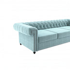 Homecrest Oakley Chesterfield sofa in light blue velvet with button tufting and silver nailhead trim on armrests.