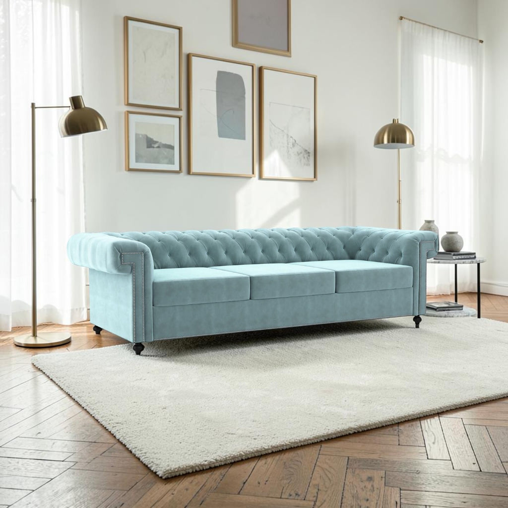Homecrest Oakley three-seater Chesterfield sofa in dusk blue velvet with tufted back and silver nailhead trim.