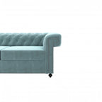 Homecrest Oakley Chesterfield sofa in dusk blue velvet with tufted backrest and silver nailhead trim on the armrest.