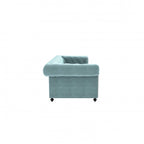Homecrest Oakley Chesterfield sofa in dusk blue velvet with button tufting and rolled armrest, side view