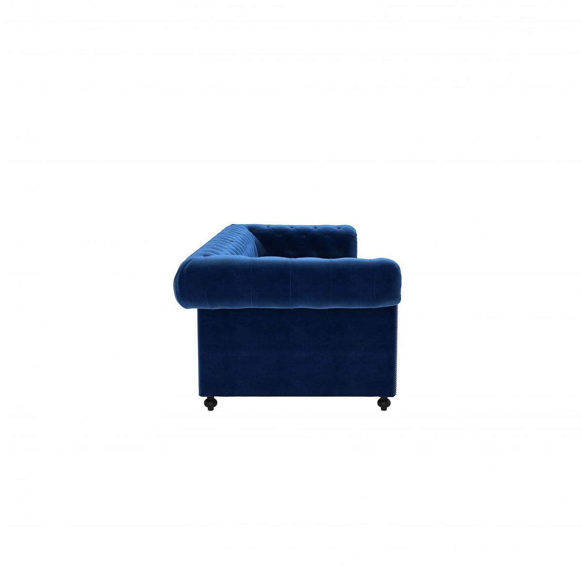 Homecrest Oakley Chesterfield sofa in indigo blue velvet with tufted detailing, side view on white background.