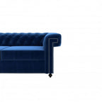Homecrest Oakley Chesterfield sofa in indigo blue velvet with tufted backrest and silver nailhead trim detail.