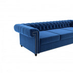 Homecrest Oakley Chesterfield sofa in indigo blue velvet with button tufting and silver nailhead trim details.